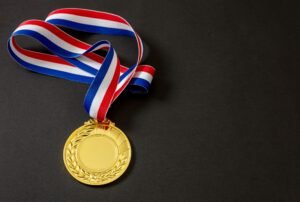 Gold medal. Champion trophy award and ribbon. Prize in sport for